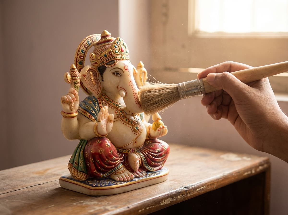 Gently dusting a hand-painted marble sculpture